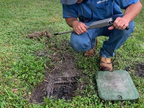 service-tech-servicing-sprinkler-system